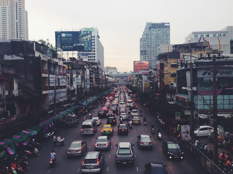 Busy city street with heavy traffic during dusk.